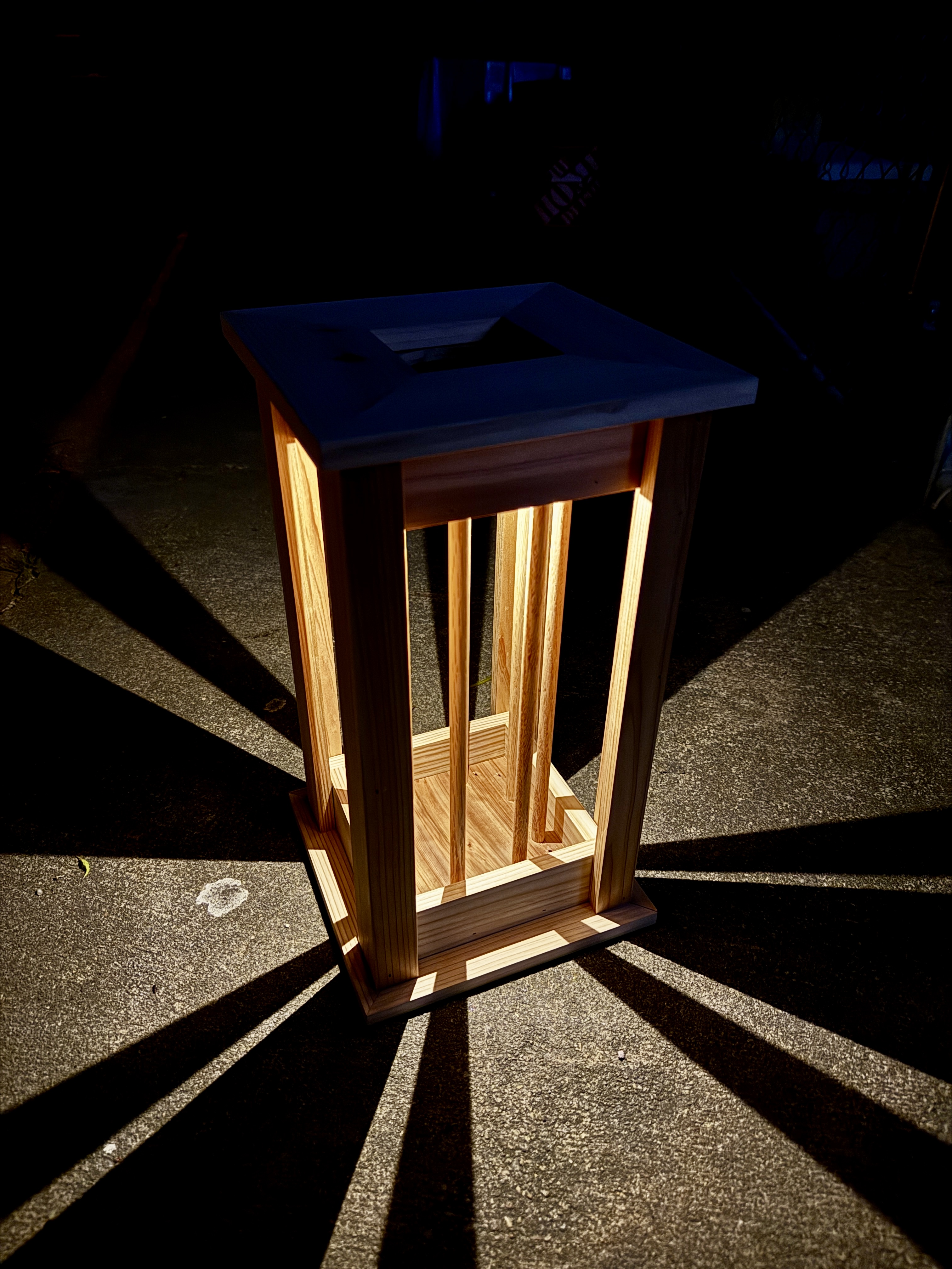Cedar lantern glowing at night