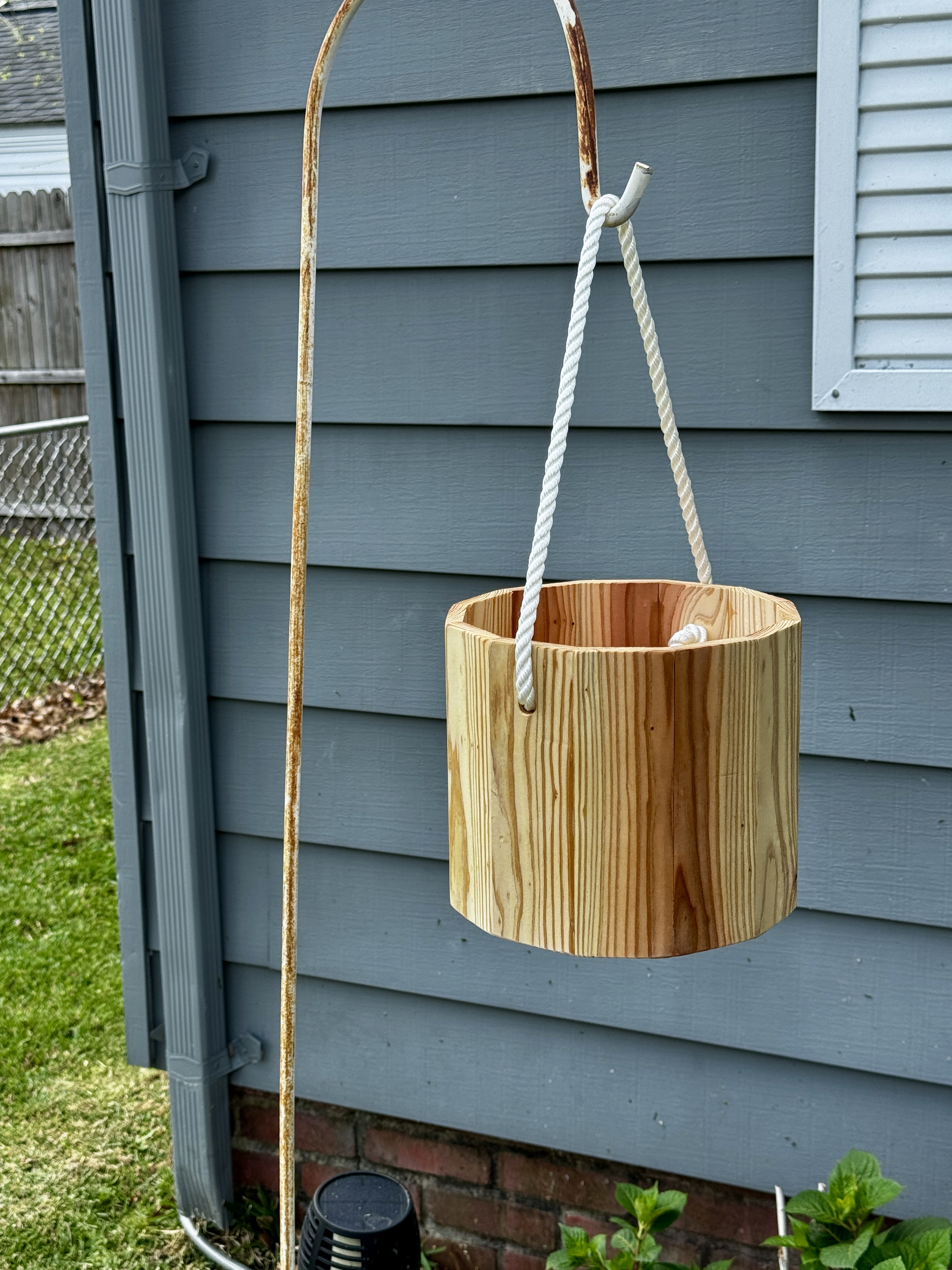 Hanging cedar planter on shepherd hook